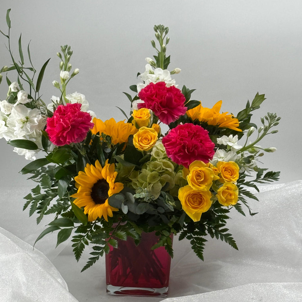 Sunburst Symphony: Vibrant Red Cube Flower Arrangement